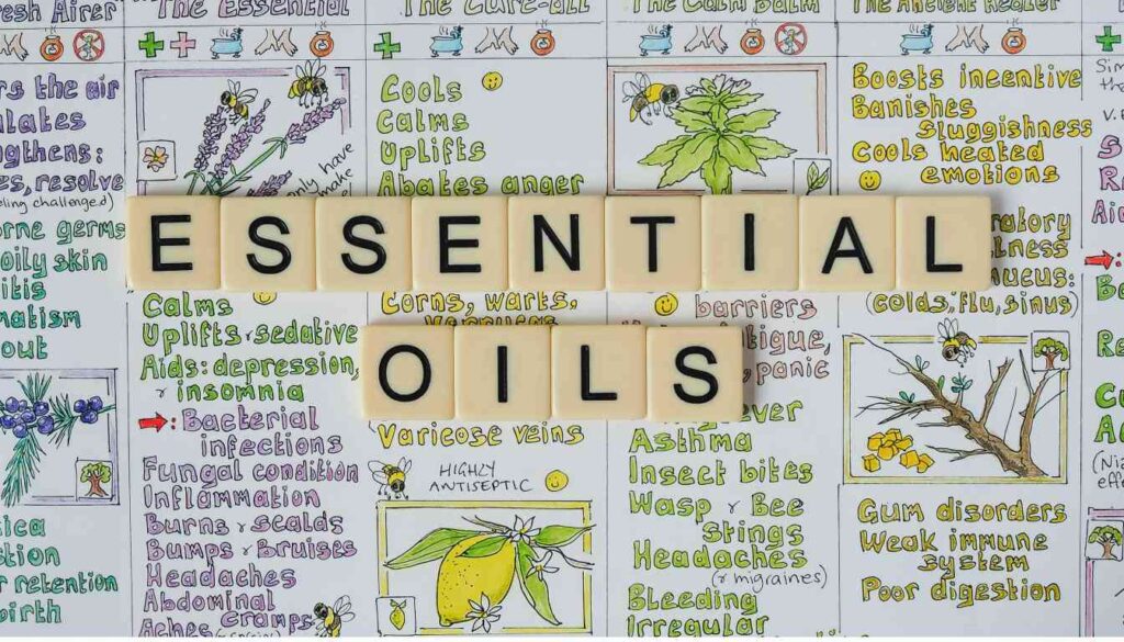 Image featuring a collage of various illustrations and words related to essential oils and their benefits, with the words “ESSENTIAL OILS” prominently displayed in the center.