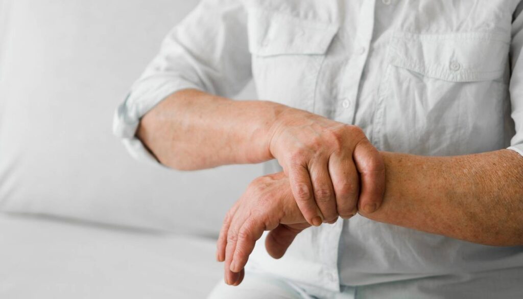 A person holding their wrist with the other hand, possibly indicating nerve pain or discomfort.