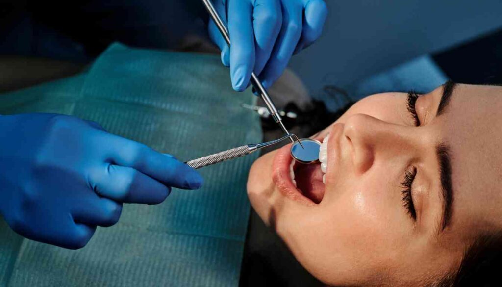 A close-up of a dental procedure being performed on a patient's mouth.