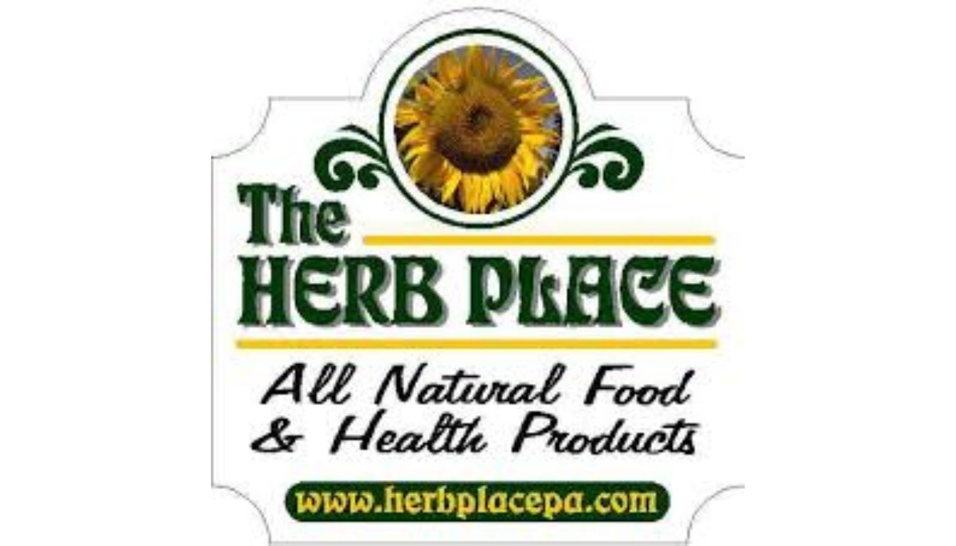 Logo for “The Herb Place” featuring a sunflower above green stylized text, with a tagline and website URL promoting natural health products.