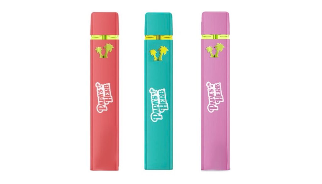 Three colorful vape pens from Papa's Herb, featuring a red, teal, and pink design with the brand's logo and palm tree icon.