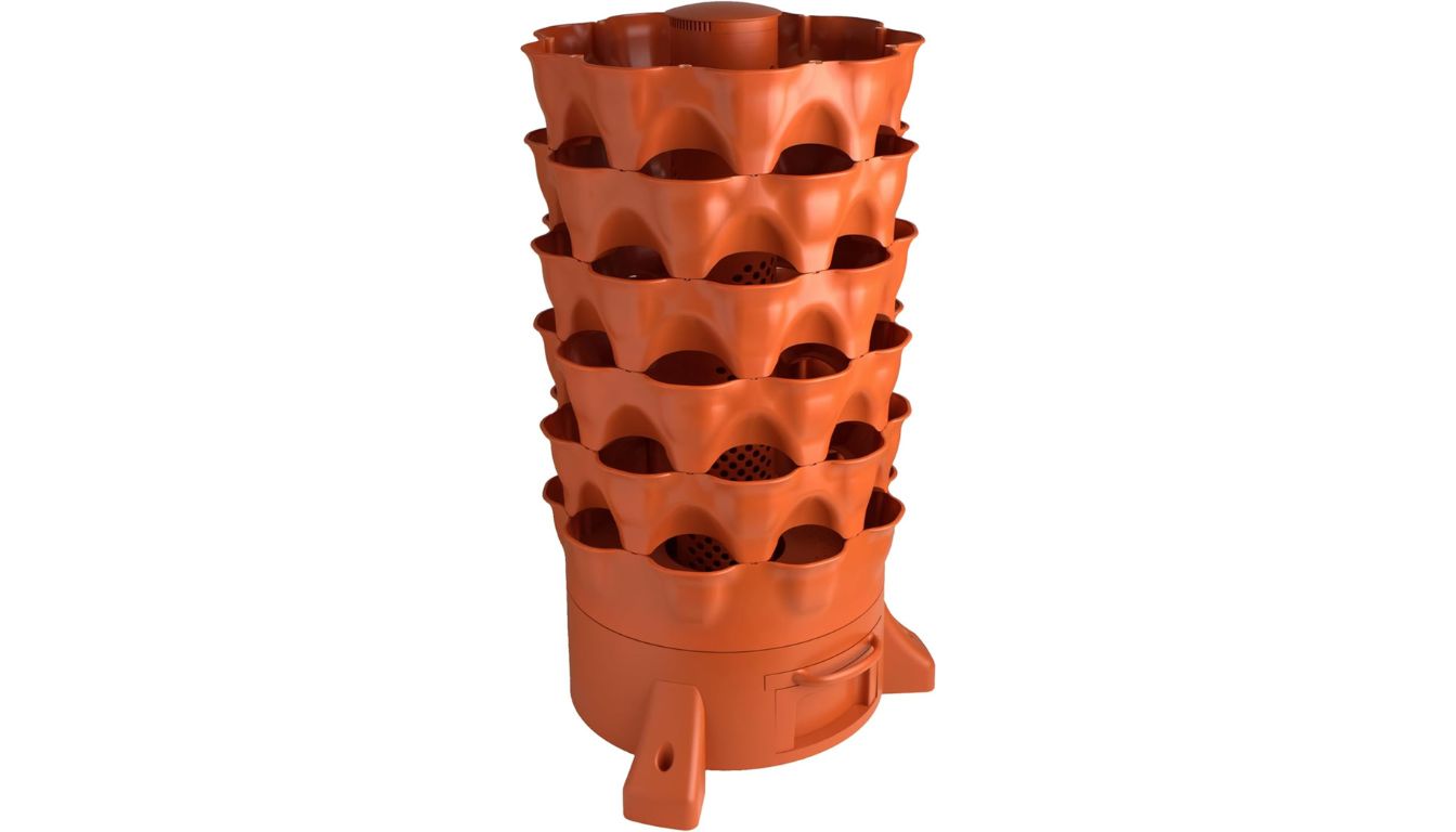 A tall, orange vertical gardening system with multiple tiers for planting, known as the Garden Tower 2.