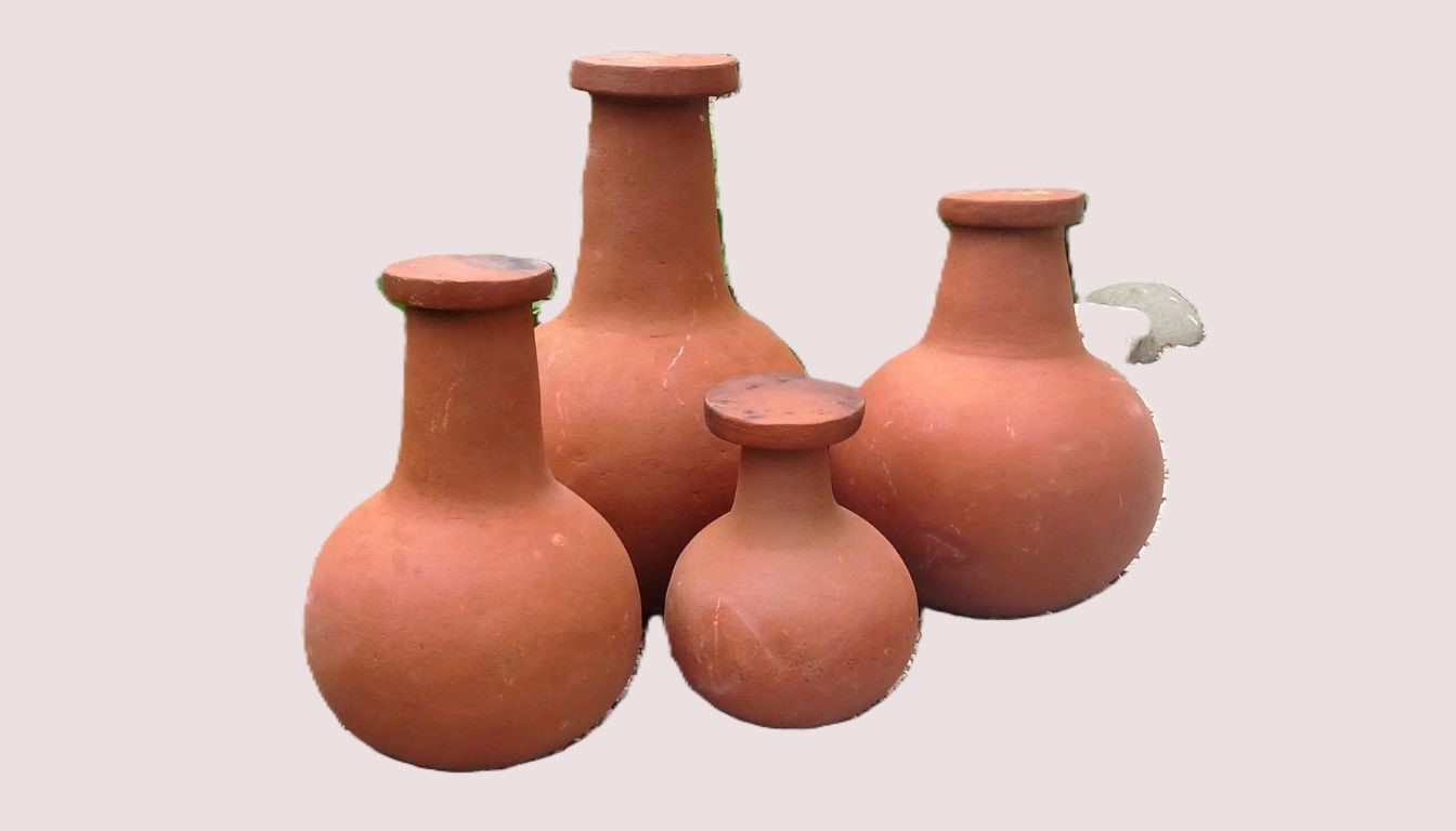 Four clay olla pots of varying sizes with round bases and narrow necks, placed together.