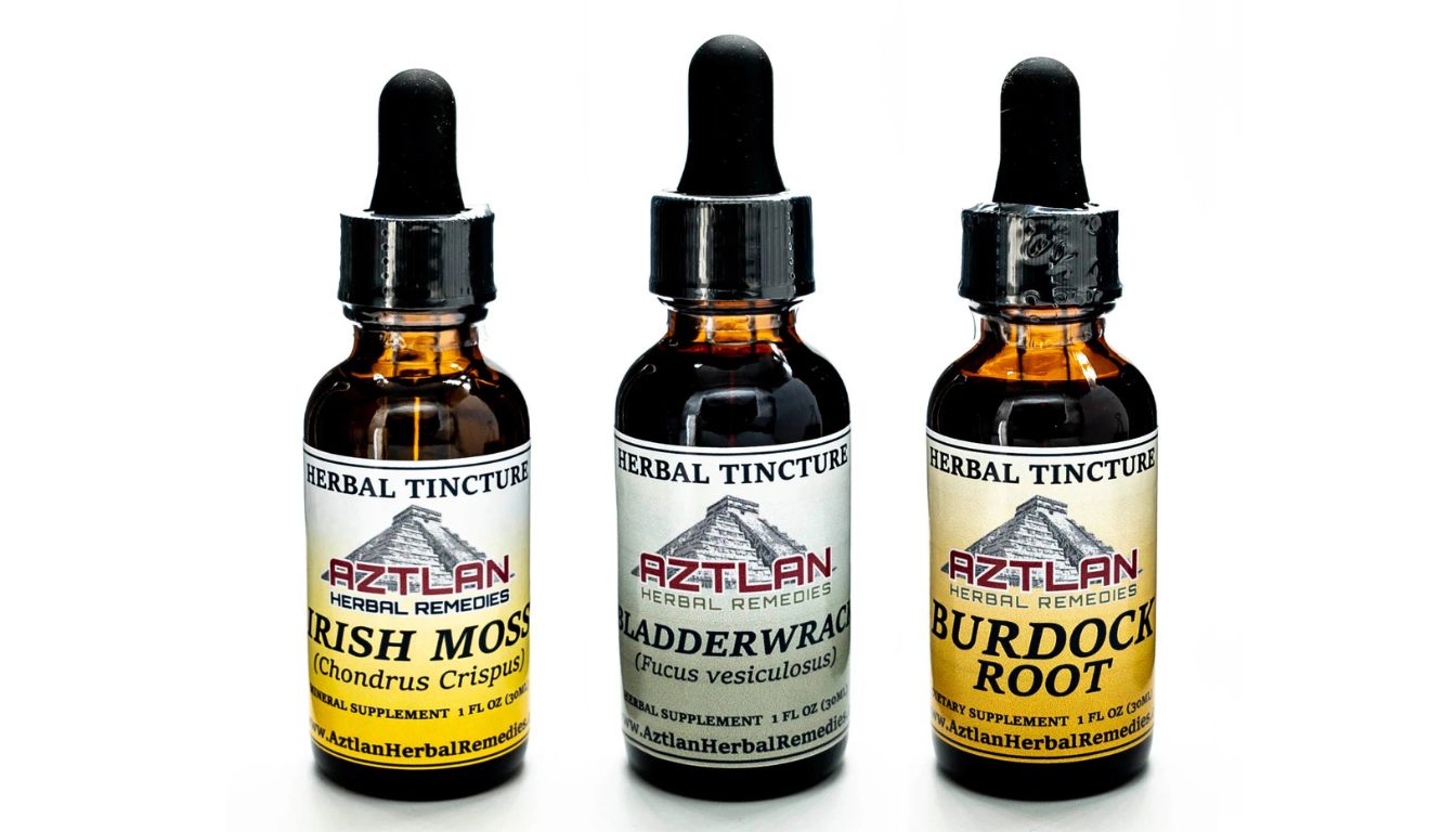 Three bottles of Aztlan Herbal Remedies tinctures, featuring Irish Moss, Bladderwrack, and Burdock Root.