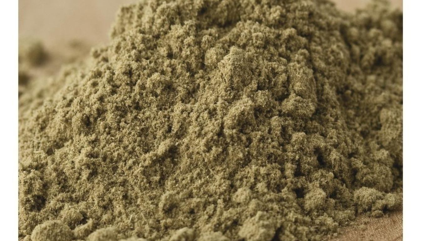 A close-up view of finely ground sage, showcasing its greenish-brown texture and powdery consistency.