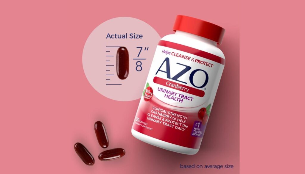 Bottle of AZO Cranberry Urinary Tract Health supplement with three softgels and a size comparison showing the actual size of the softgels as 7/8 inches.