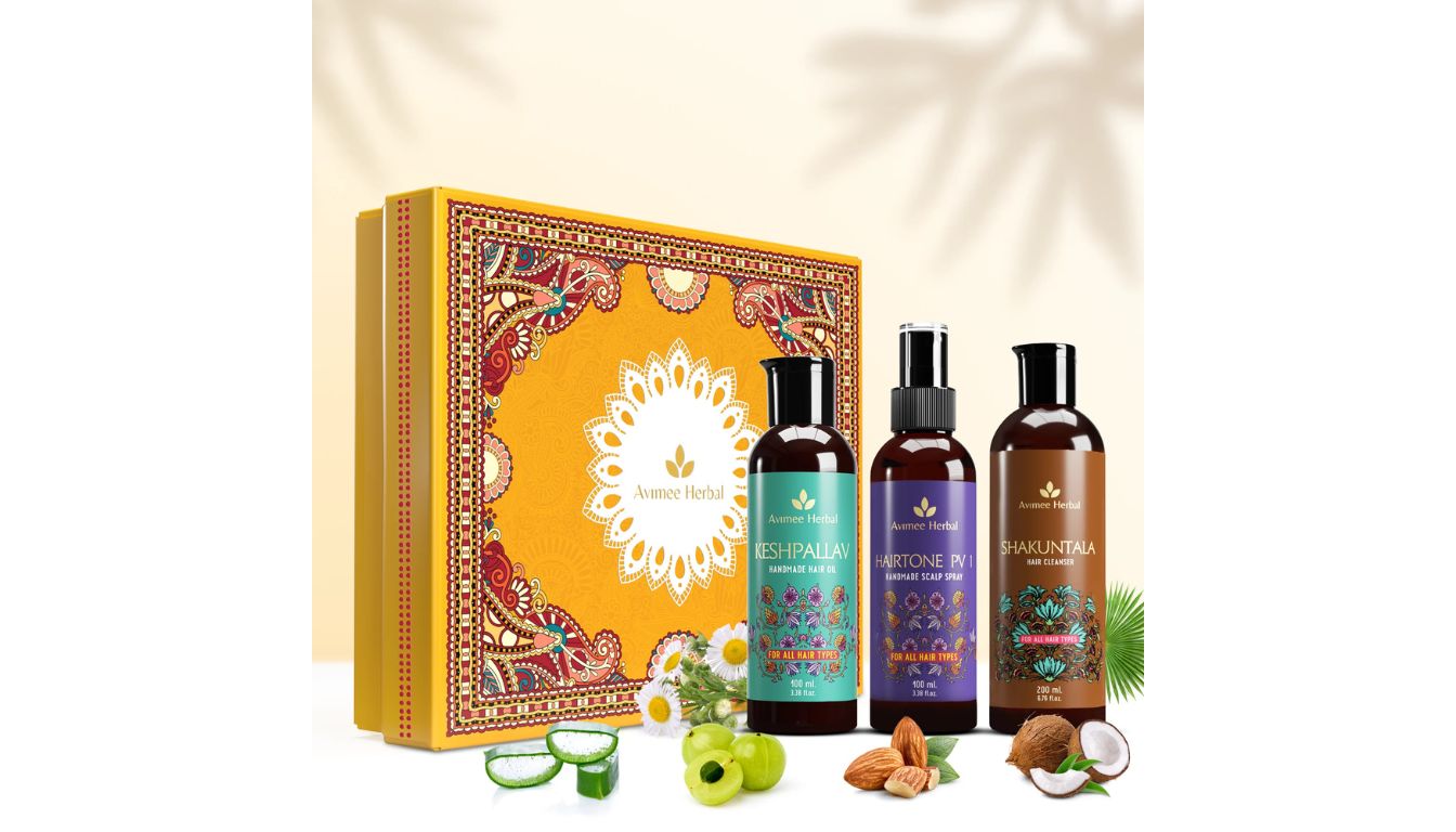 Three bottles of Avimee Herbal hair care products, including Keshpallav, Shakuntala, and Hairtone PV, displayed with natural ingredients like amla, almonds, and herbs.