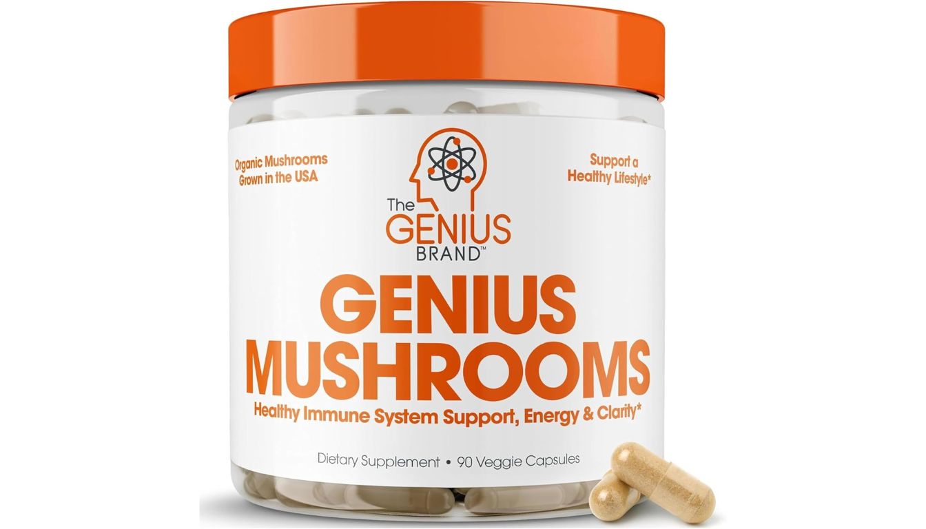 A container of Genius Mushrooms dietary supplement with an orange lid, featuring the label "Genius Mushrooms" and "Healthy Immune System Support, Energy & Clarity." The container holds 90 veggie capsules.