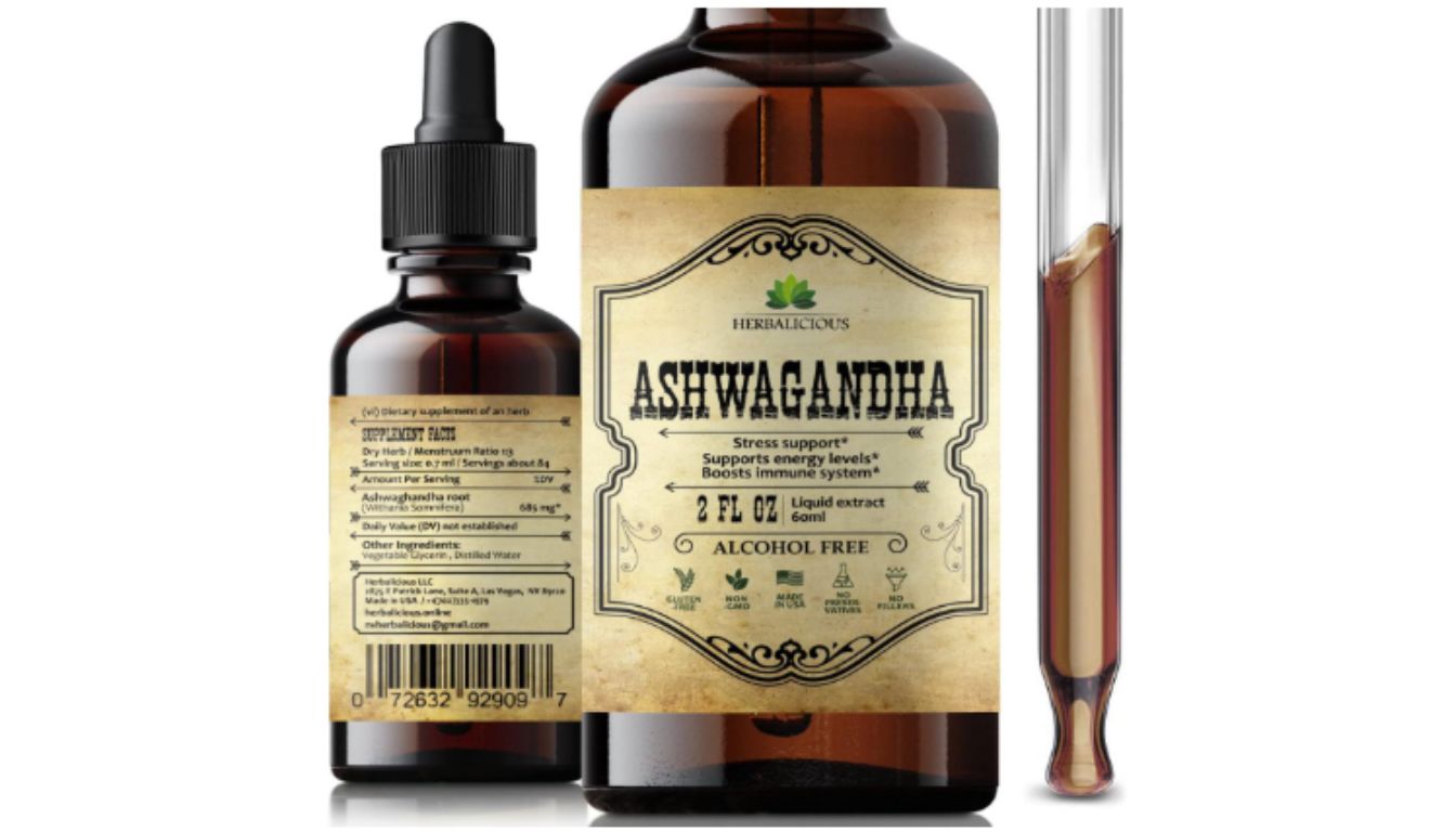 A bottle of Herbalicious Ashwagandha liquid extract supplement with a dropper and a test tube containing the extract.