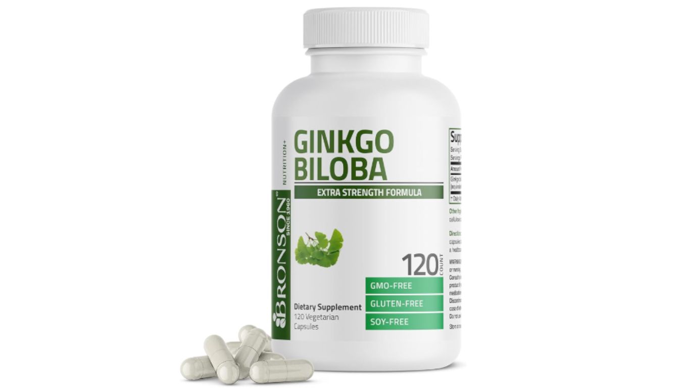 A bottle of Bronson Ginkgo Biloba Extra Strength Formula dietary supplement with 120 vegetarian capsules, labeled as GMO-free, gluten-free, and soy-free, with several capsules lying in front of the bottle.