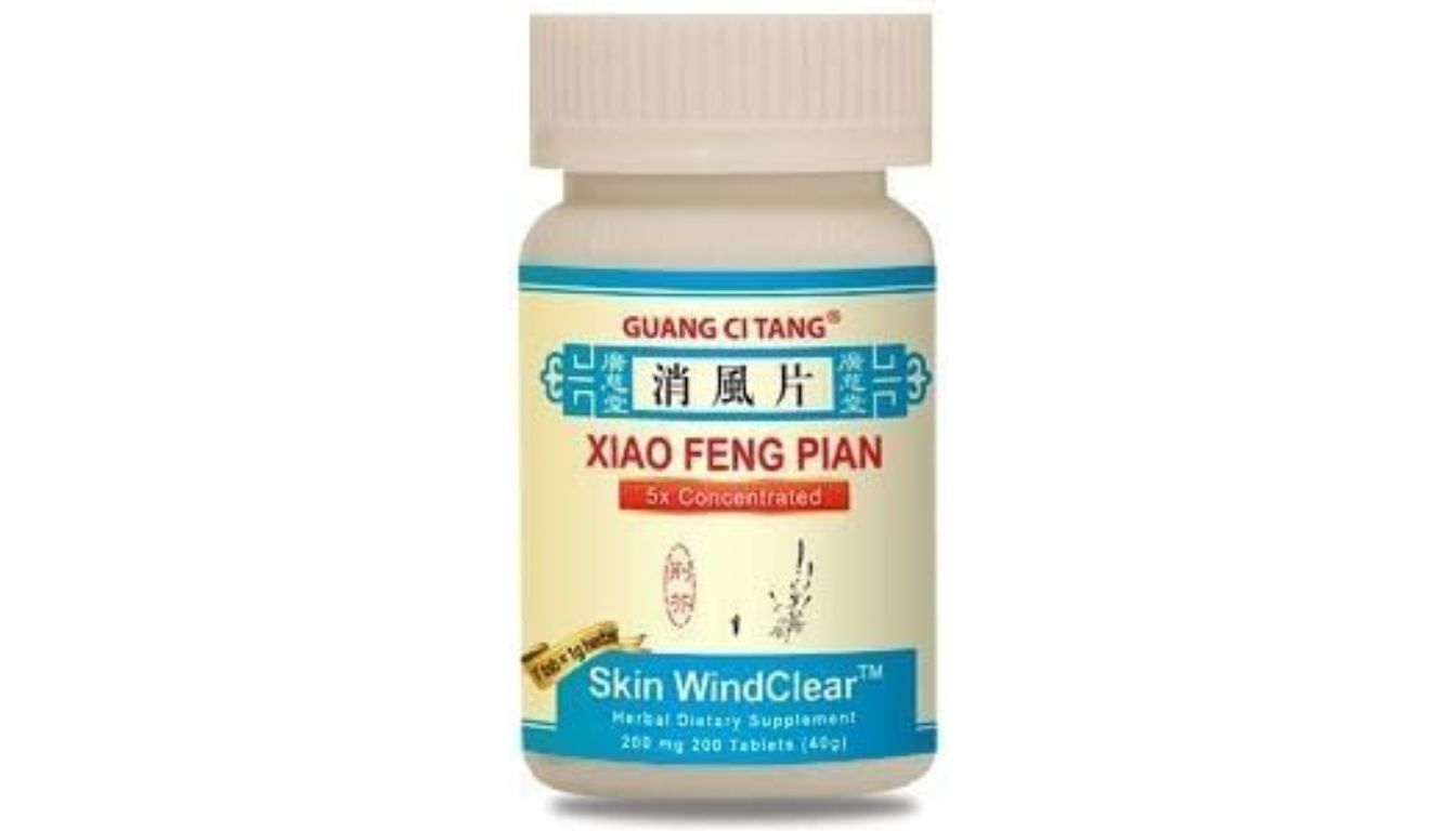 A bottle of Guang Ci Tang Xiao Feng Pian herbal dietary supplement.