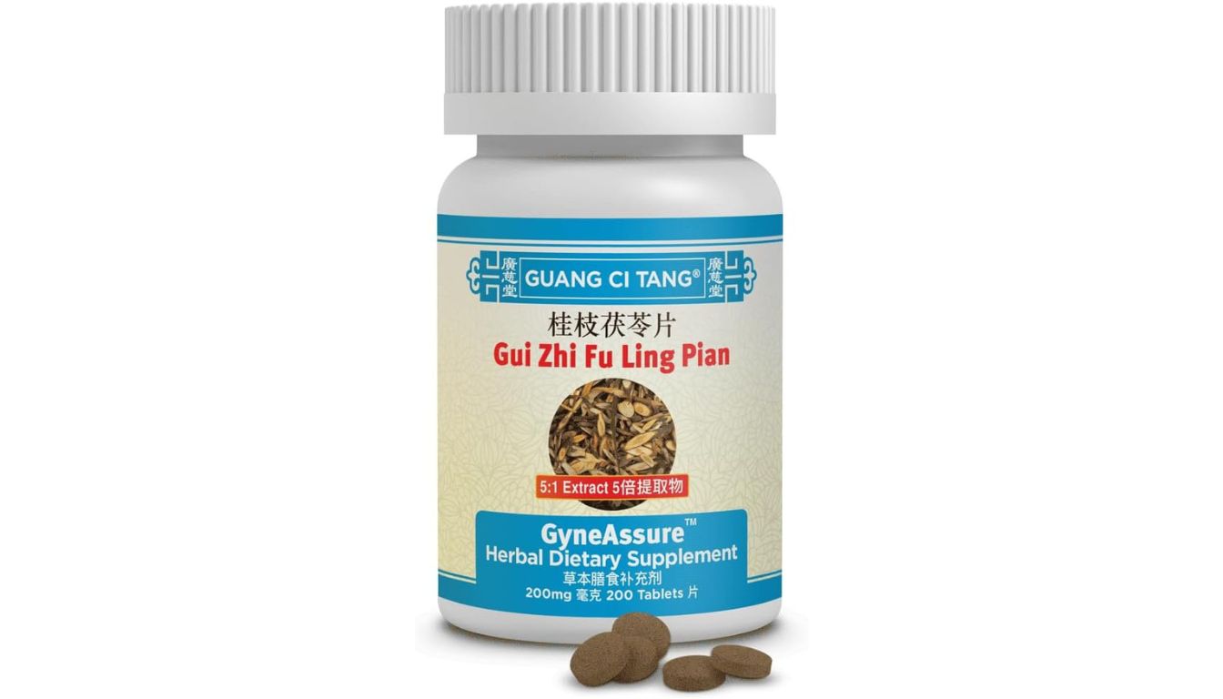 A bottle of Guang Ci Tang GyneAssure Herbal Dietary Supplement, labeled Gui Zhi Fu Ling Pian, with 200 tablets of 200mg each. The bottle features a blue and white label with an image of the herbal ingredients and the text '5:1 Extract' in red.