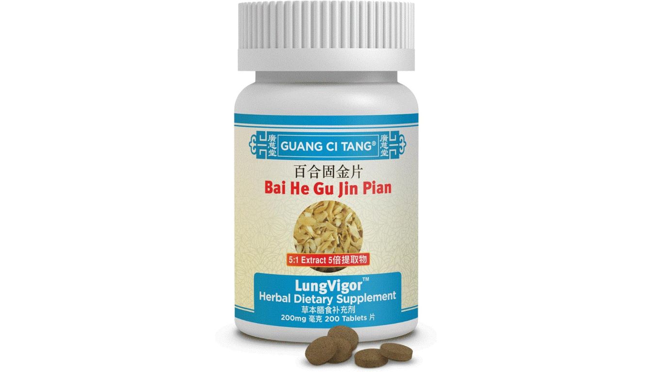 A bottle of Guang Ci Tang Bai He Gu Jin Pian LungVigor Herbal Dietary Supplement with tablets in front.