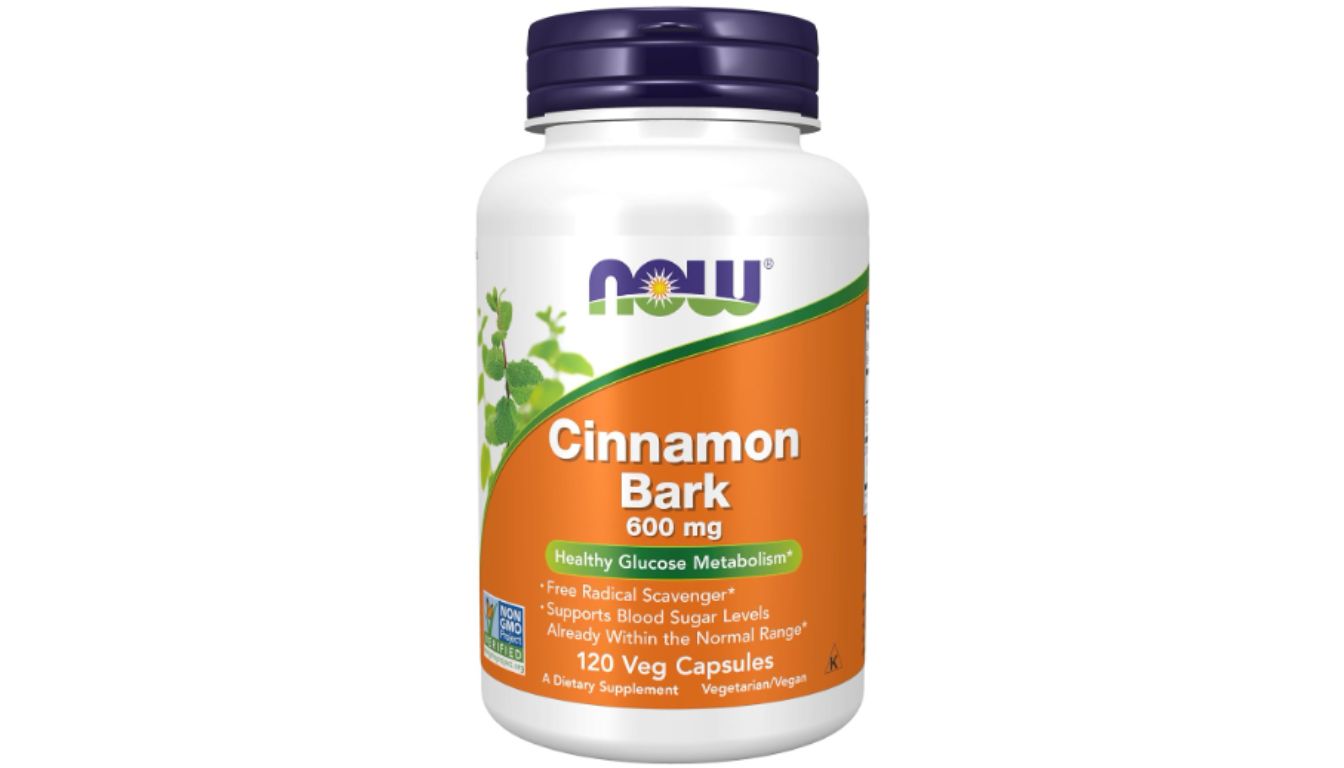 A bottle of NOW Supplements Cinnamon Bark 600 mg, featuring a white and orange label with green accents, containing 120 vegetarian capsules.