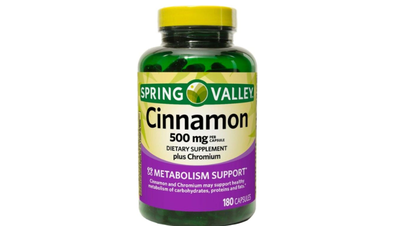 A bottle of Spring Valley Cinnamon 500 mg dietary supplement capsules.