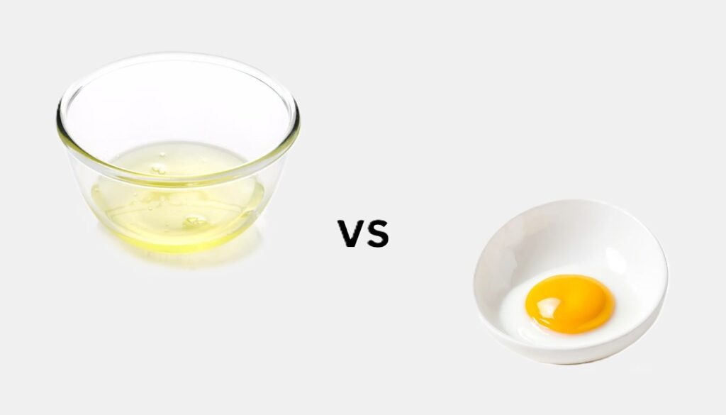 A side-by-side comparison of a bowl filled with egg whites and another with egg yolks, highlighting their distinct colors and textures.