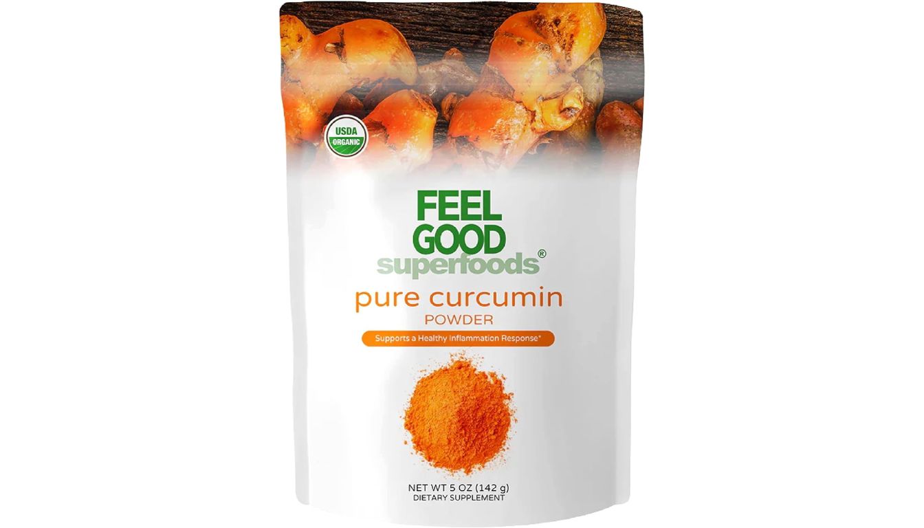 A package of Feelgood Organic Superfoods Pure Curcumin Powder, featuring turmeric roots and a vibrant orange curcumin powder.