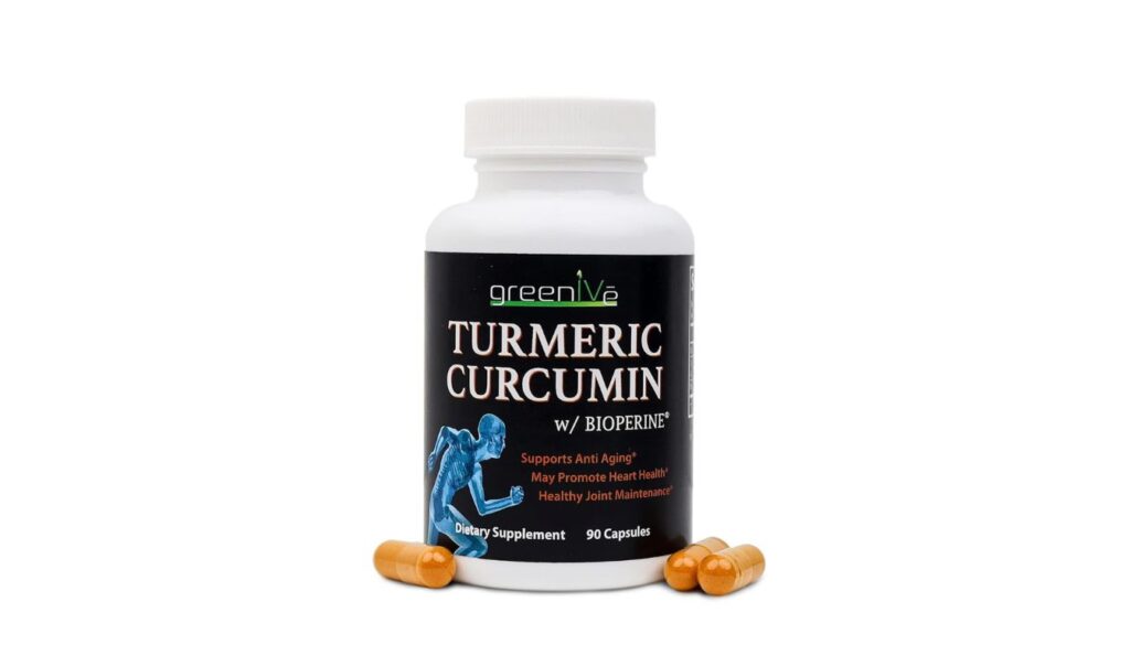 A bottle of GreenIVe Turmeric Curcumin BioPerine Capsules, surrounded by a few capsules, showcased on a white surface.