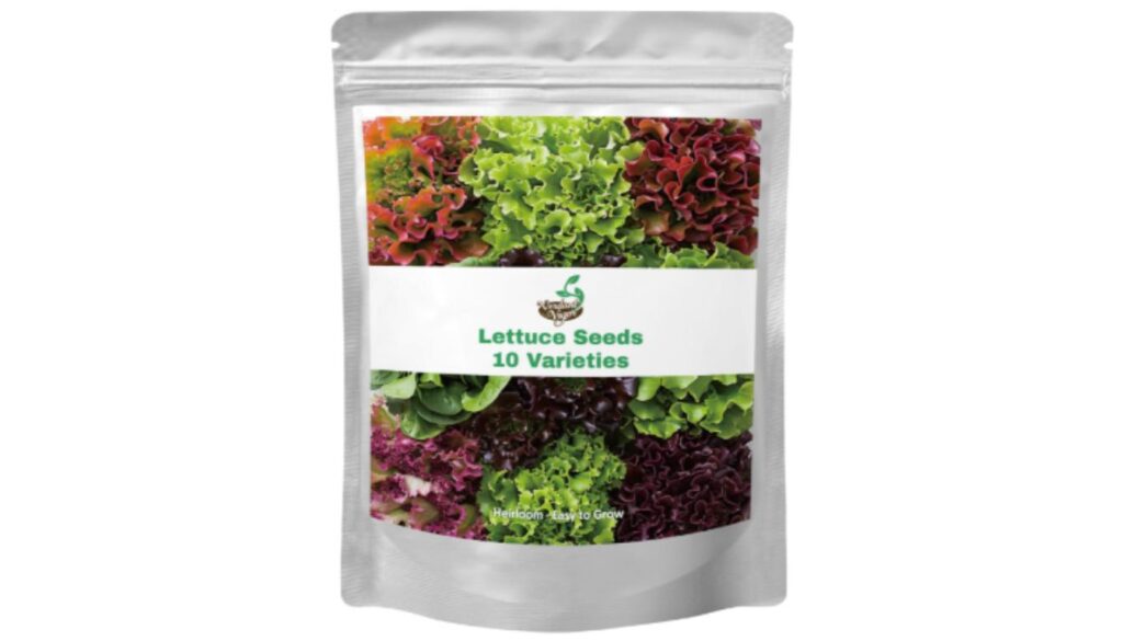 A packet of Sweet Yards California Giants Mix Zinnia wildflower seeds with colorful zinnia flowers and a small pile of seeds in front.