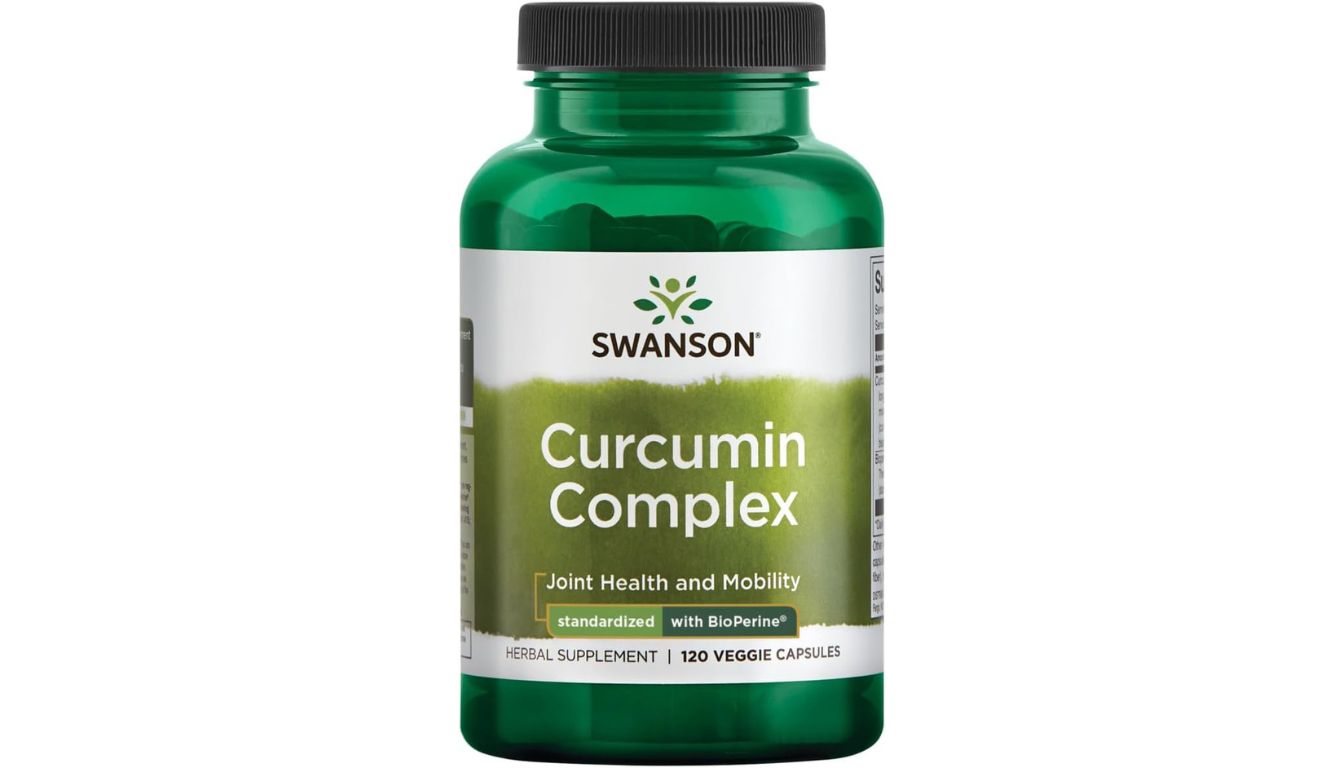 A green bottle of Swanson Curcumin Complex dietary supplement, designed to support joint health and mobility.