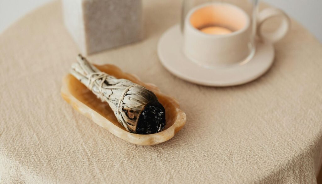 A close-up of assorted aromatherapy smoking herbs-lavender, chamomile, sage, mugwort, and peppermint-arranged on a rustic wooden surface with soft natural light.