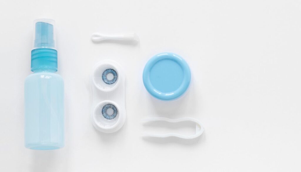 A neat arrangement of essential ingredients—a measuring cup of distilled water, a pinch of salt, and a contact lens case—laid out on a countertop for creating a DIY contact lens solution.
