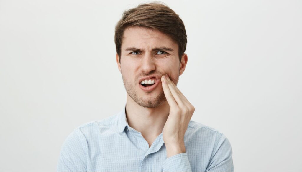 A close-up of a smiling person showing healthy, white teeth, emphasizing natural dental care and cavity prevention.