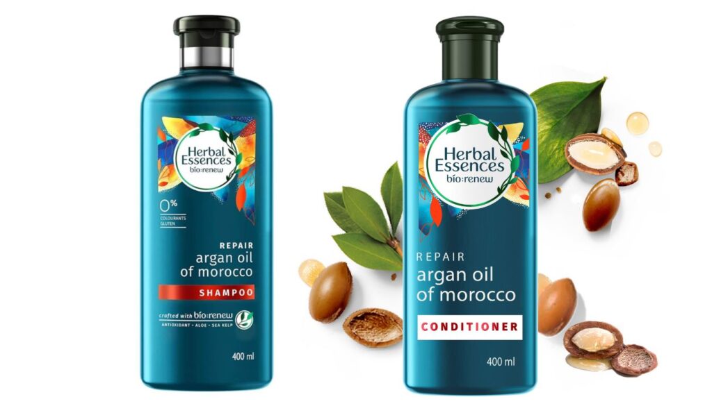 Two 400ml bottles of Herbal Essences bio:renew Argan Oil Shampoo and Conditioner with vibrant packaging and botanical imagery.