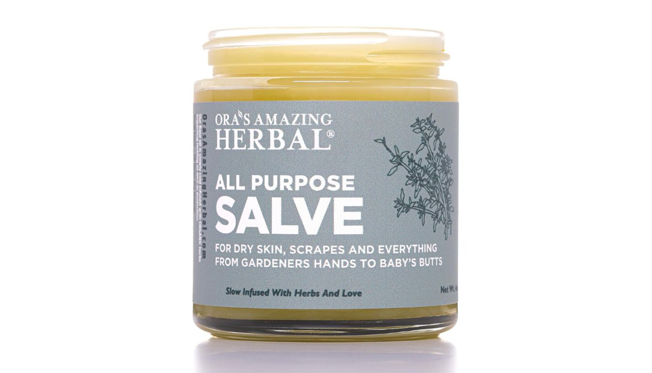 Jar of Ora's Amazing Herbal All Purpose Salve with gray label and botanical illustration.