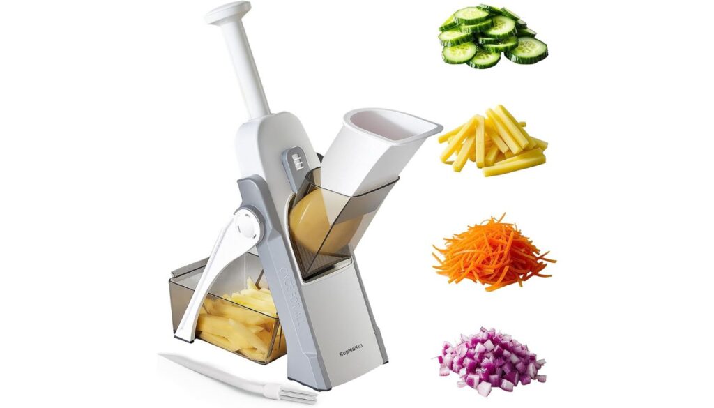 SupMaKin Safe Mandoline Slicer with hand-operated mechanism and assorted sliced vegetables including potatoes, cucumbers, carrots, and onions.