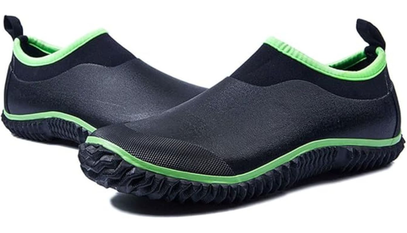 Black waterproof garden shoes with green trim, slip-on design, and textured rubber soles.