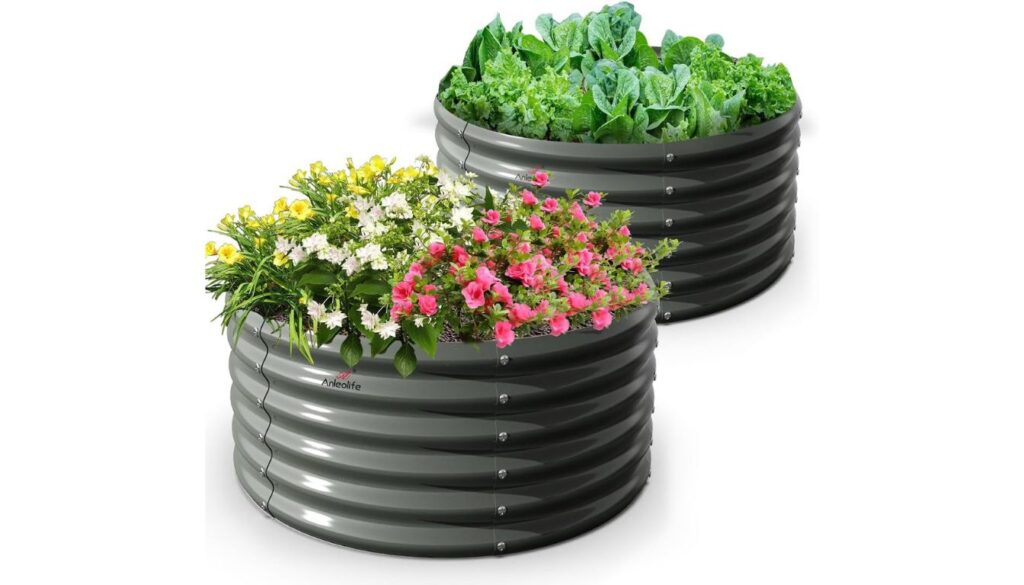Two round Anleolife galvanized raised beds with flowers and leafy greens